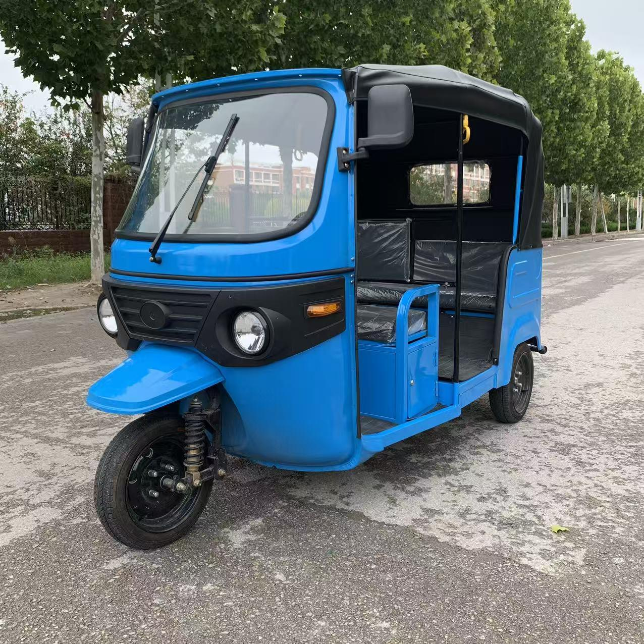 Wholesale 1500W enclosed electric passenger trike (3-seater). Features built-in cabin heater, Arctic-ready chassis, and solar options. Get FCL quotes today.